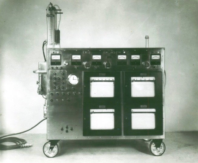 A black-and-white photo of the first heart-lung machine.