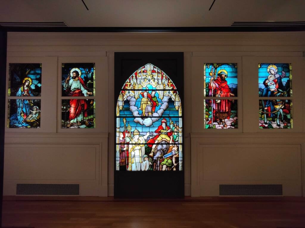 Illuminated panels show off some of St. Joseph’s extensive collection of religious stained glass windows