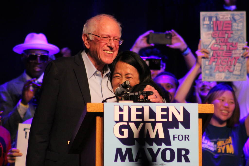 U.S. Sen. Bernie Sanders and mayoral candidate Helen Gym embrace