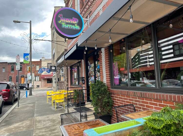 South Philly restaurant Juana Tamale was penalized by the city for its sign that is 8 inches larger than what officials said was allowed under zoning law.
(Kristen Mosbrucker/ WHYY News)
