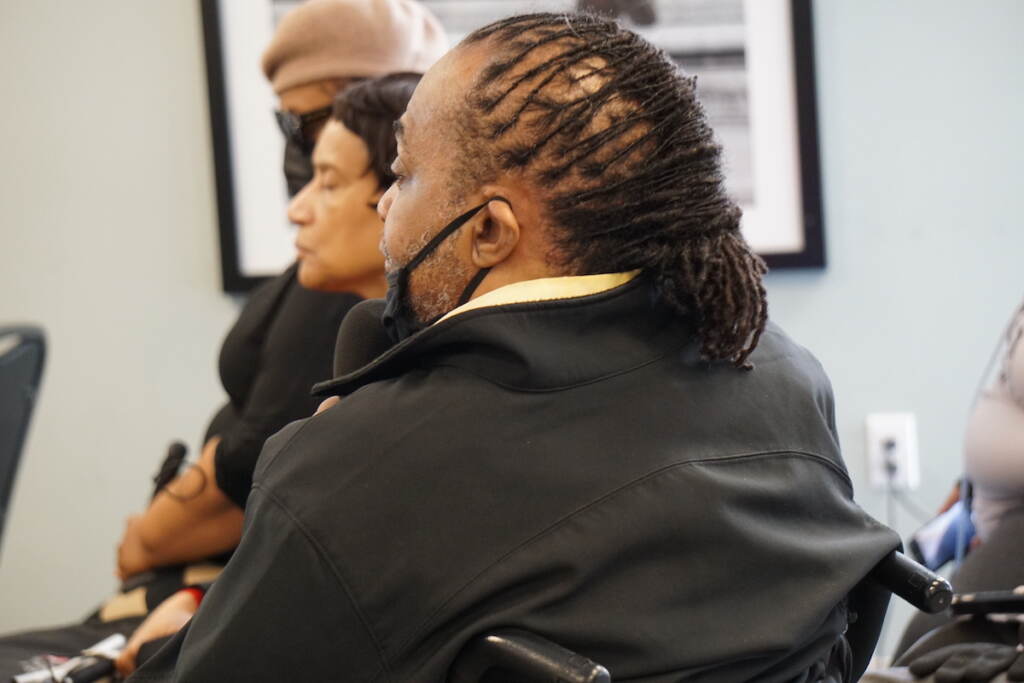 Charles Horton looks on at a candidate forum.