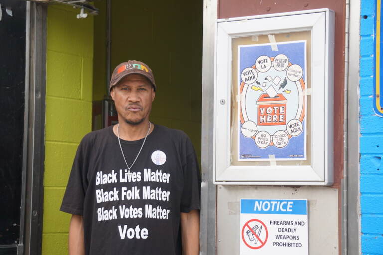 Anthony C. Jones poses outside of a polling station.