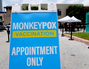 A sign for monkeypox vaccinations is shown at a vaccination site in Miami Beach