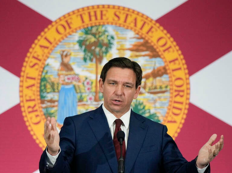 Florida Gov. Ron DeSantis speaks during a news conference to sign several bills related to public education and increases in teacher pay, in Miami, Tuesday, May 9, 2023. DeSantis and former President Donald Trump will share the spotlight in Iowa on Saturday, May 13, providing a chance to sway influential conservative activists and contrast their campaign styles in Republicans' leadoff voting state. (AP Photo/Rebecca Blackwell)