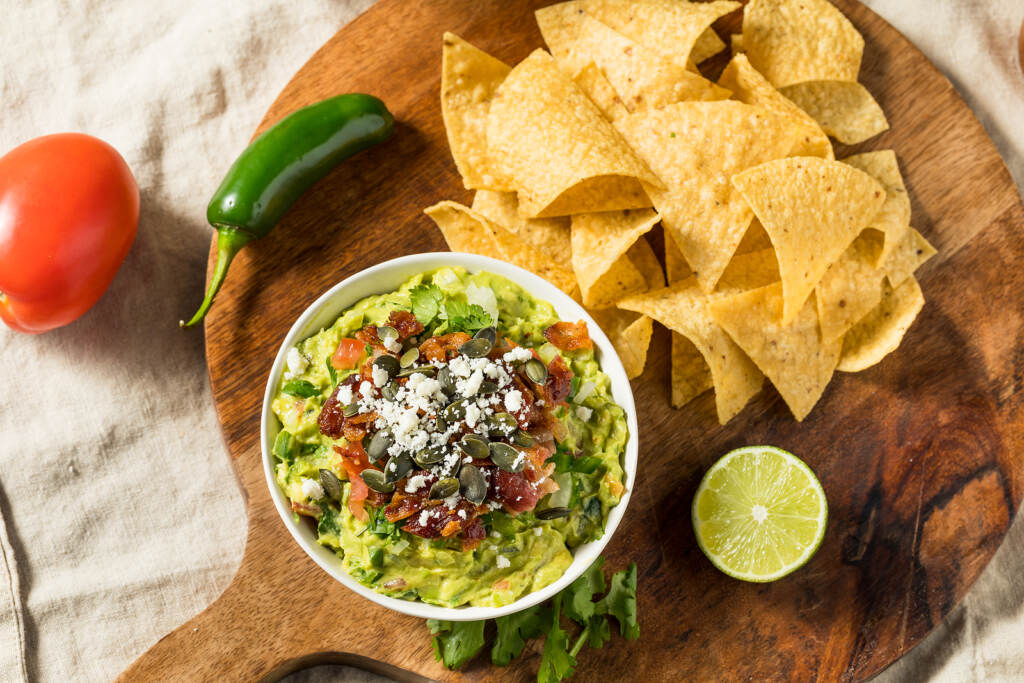 A view of guacamole and chips from above.