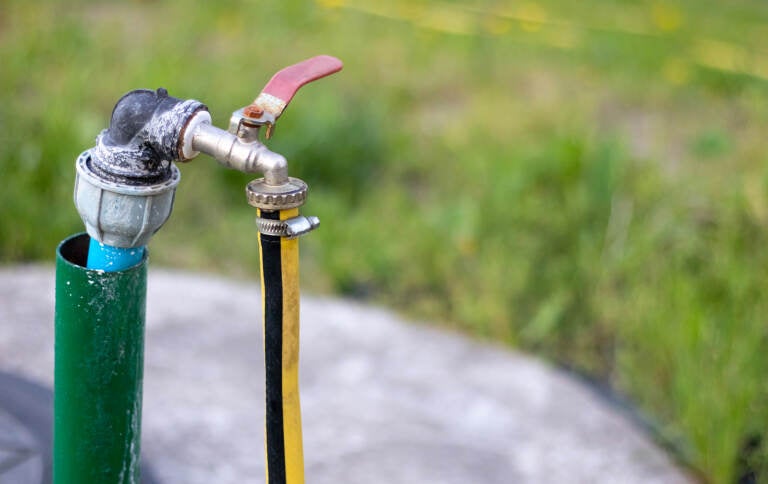 a pump connected to a water well.