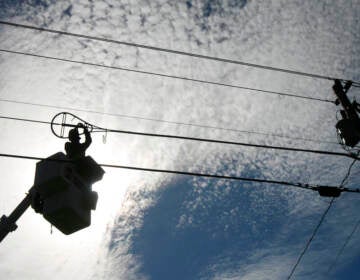 A worker repairs a broadband internet