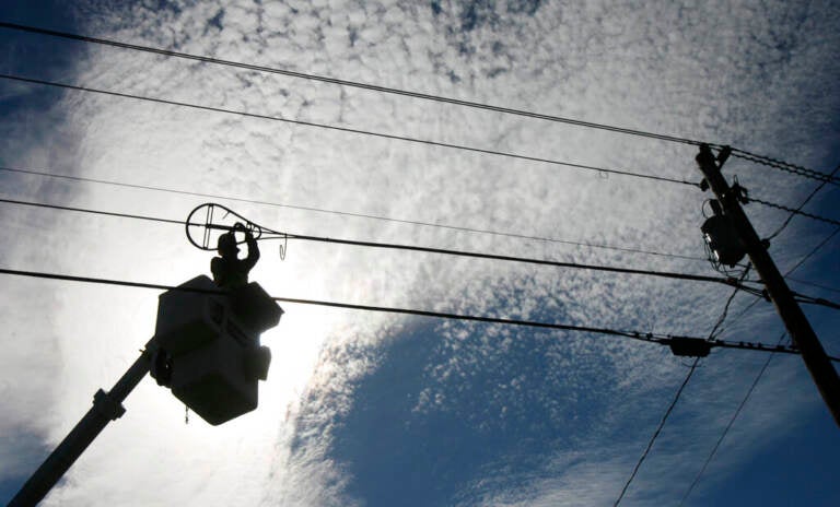 A worker repairs a broadband internet