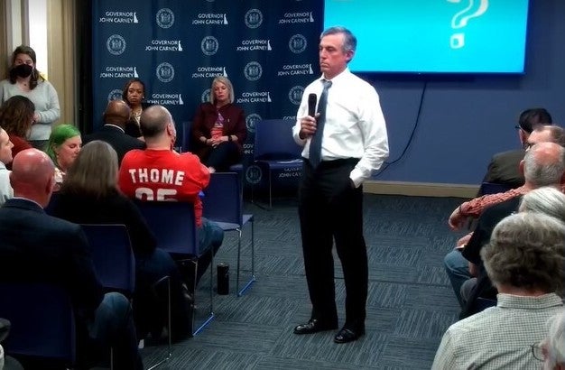 Gov. Carney speaks to a group of people at a town hall.