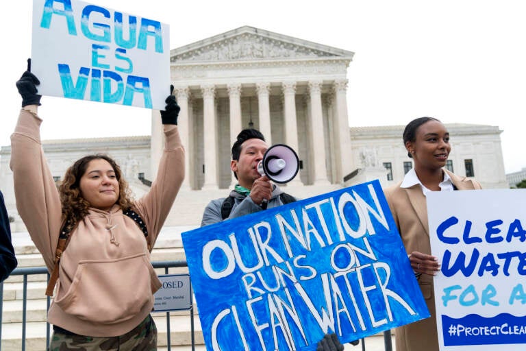 Clean Water Act supporters protest outside the Supreme Court