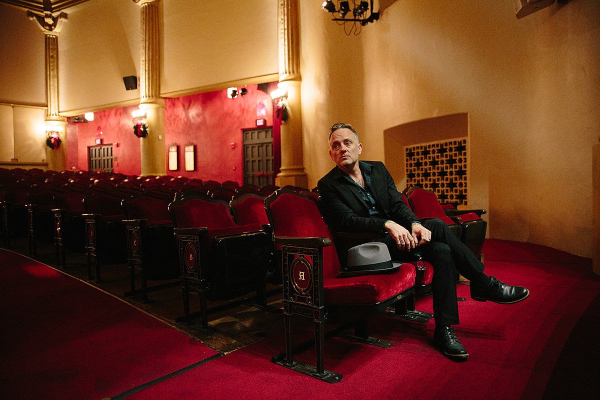 David Hause poses in a theater