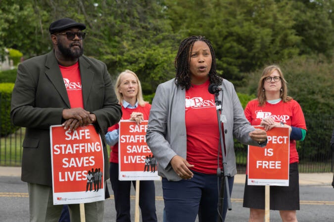 Delaware County council members Richard Womack (left) and Monica Taylor (right) told picketing Crozer-Chester nurses that they would support them at a rally outside the hospital on May 19, 2023. (Kimberly Paynter/WHYY)