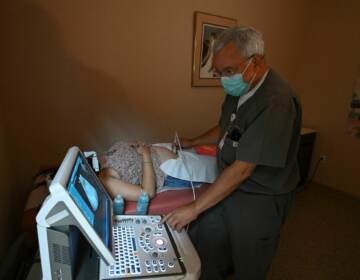 Dr Franz Theard performs a sonogram to confirm pregnancy on a patient seeking abortion services at the Women's Reproductive Clinic, which provides legal medication abortion services, in Santa Teresa, New Mexico, on June 15, 2022. - In the wake of Friday's ruling by the US Supreme Court striking down Roe v Wade and the federally protected right to an abortion, women from Texas and other states are traveling to clinics like the Women's Reproductive Health Clinic in New Mexico for legal abortion services under the state's more liberal laws. - RESTRICTED TO EDITORIAL USE (Photo by Robyn Beck / AFP) / RESTRICTED TO EDITORIAL USE (Photo by ROBYN BECK/AFP via Getty Images)