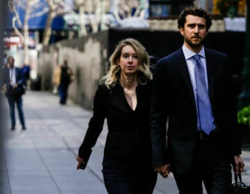 Former Theranos CEO Elizabeth Holmes alongside her partner Billy Evans, walks back to her hotel following a hearing at the Robert E. Peckham U.S. Courthouse on March 17, 2023 in San Jose, Calif. Holmes is set to start her 11-year prison sentence on Tuesday.