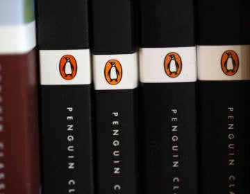 A row of books from Penguin Random House publisher are visible.