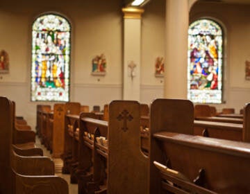 Inside of a church with stained glass windows