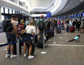 SAN FRANCISCO, CALIFORNIA - JULY 01: Travelers line up to check in for United Airlines flights at San Francisco International Airport on July 01, 2022 in San Francisco, California. According to AAA, nearly 48 million Americans are expected to hit the road for the Fourth of July holiday weekend and will travel more than 50 miles away from their home. It will be the second busiest July 4 travel weekend since 2000. (Photo by Justin Sullivan/Getty Images)