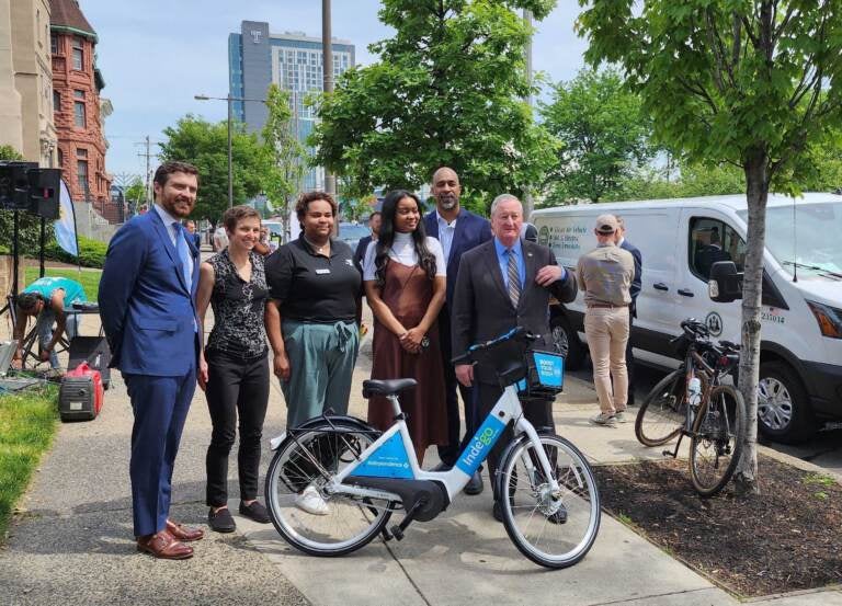 Officials posing at a press conference for the newest Bike share station.