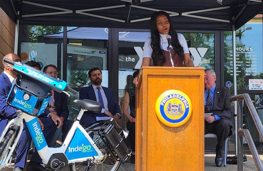 Waffiyyah Murray speaking at a podium