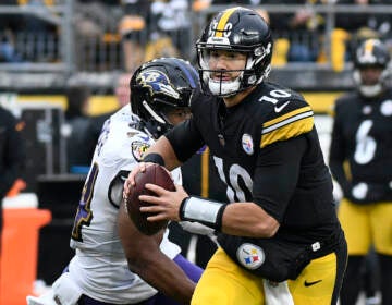 Pittsburgh Steelers quarterback Mitch Trubisky looks to pass under pressure from Baltimore Ravens linebacker Tyus Bowser during the second half of an NFL football game in Pittsburgh, Sunday, Dec. 11, 2022. Trubisky signed a three-year contract with the Steelers, Friday, May 19, 2023, to remain the backup behind second-year starter Kenny Pickett. (AP Photo/Don Wright, File)