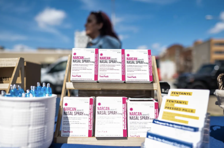 Boxes of Narcan sitting on a table.