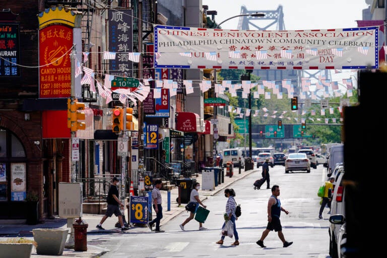 Pedestrians walk in Philadelphia's Chinatown