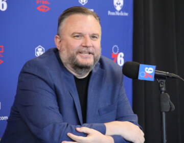 Daryl Morey talks into a microphone at a press conference.