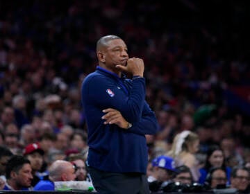 Doc Rivers standing on the sideline during a game.