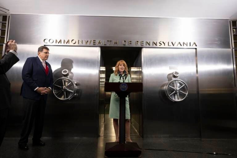 Stacy Garrity speaking at a podium