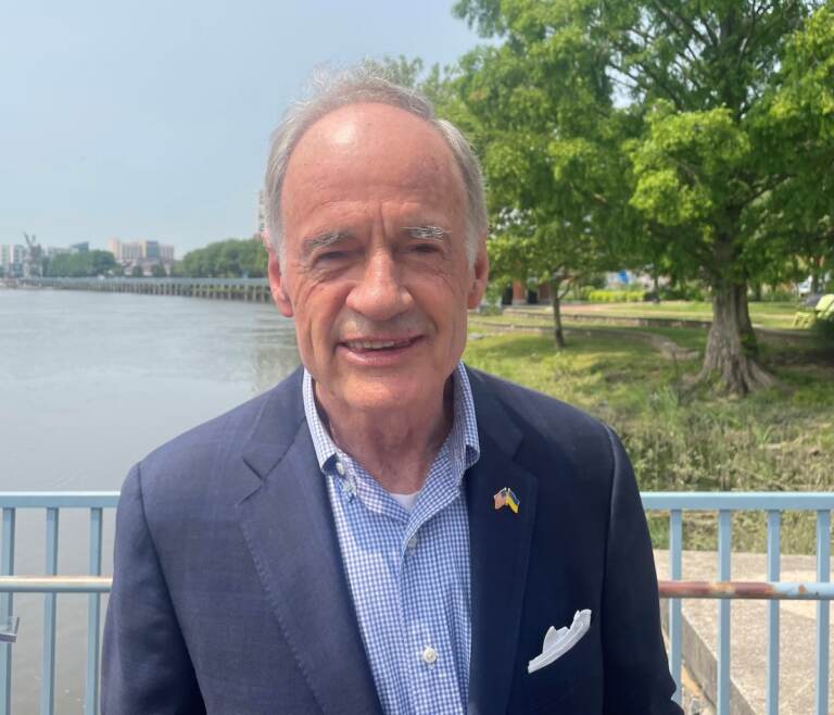 Four-term incumbent U.S. Sen. Tom Carper announced he was not seeking re-election in 2024 during a speech at the redeveloped Wilmington Riverfront that his gubernatorial administration helped create in the 1990s. (Cris Barrish/WHYY)