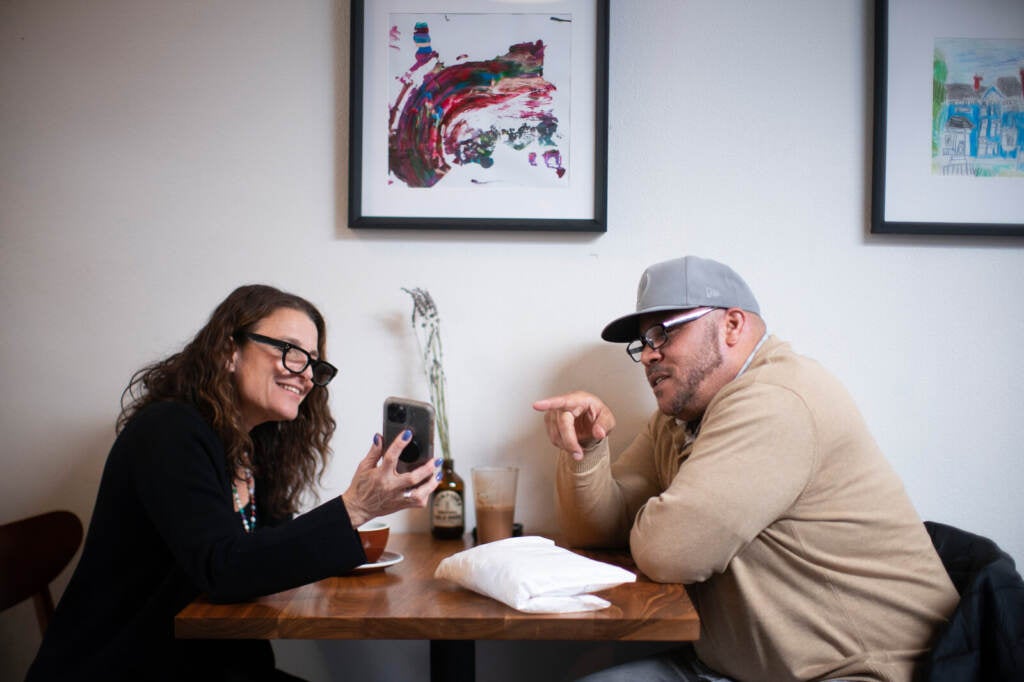 Tacuma Jackson catches up with Aliza Kaplan over coffee at Stumptown Coffee Roasters in Portland, Ore., on April 19. Kaplan is a law professor at Lewis & Clark Law School and assisted Jackson with his clemency
