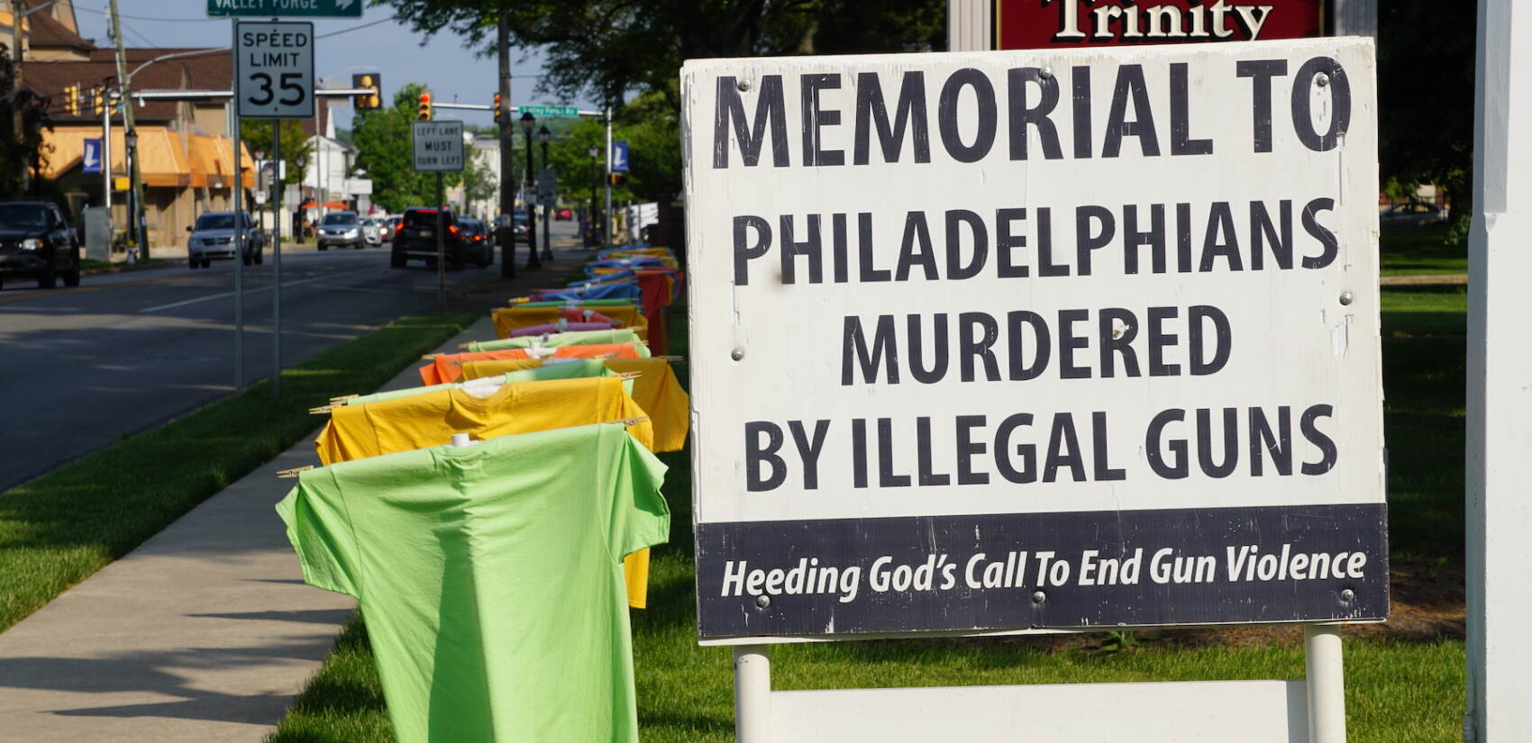t shirt memorial on a lawn showing names of people killed