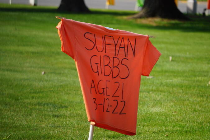 t-shirt showing the name, age, and date of death for someone killed by gun violence