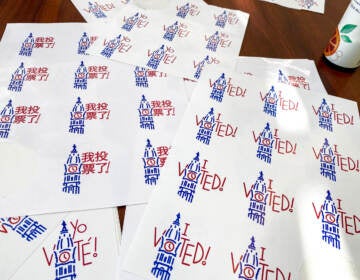 Sheets of Philadelphia ''Voted'' stickers on a table.