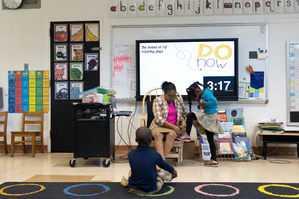 Nicole Miller in her classroom with students