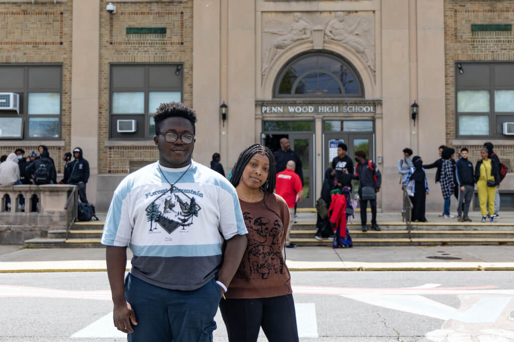 Students Paul Vandy and Trinity Giddings pose for a photo in front of Penn Wood High School
