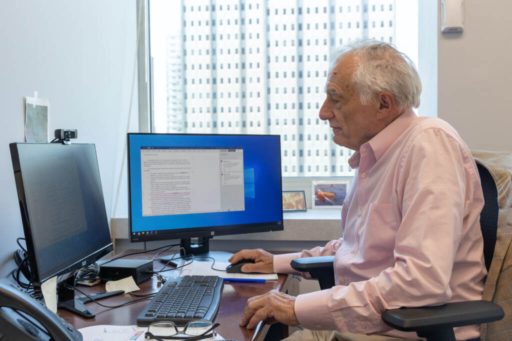 Michael Churchill working at his desk