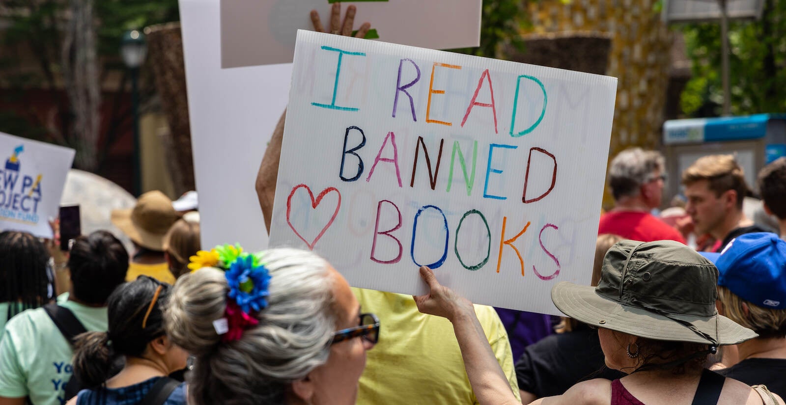 A protest sign reads ''I read banned books''