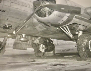 In a photo from the Papers of J. Hartley Bowen Jr. at the Science History Museum, workers load a barrel of contaminated waste into a B-17 aircraft. (The Papers of J. Hartley Bowen Jr. at the Science History Museum)