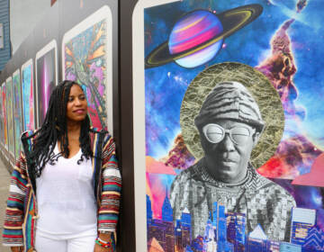 Li Sumpter posing by a tarot card featuring Sun Ra.