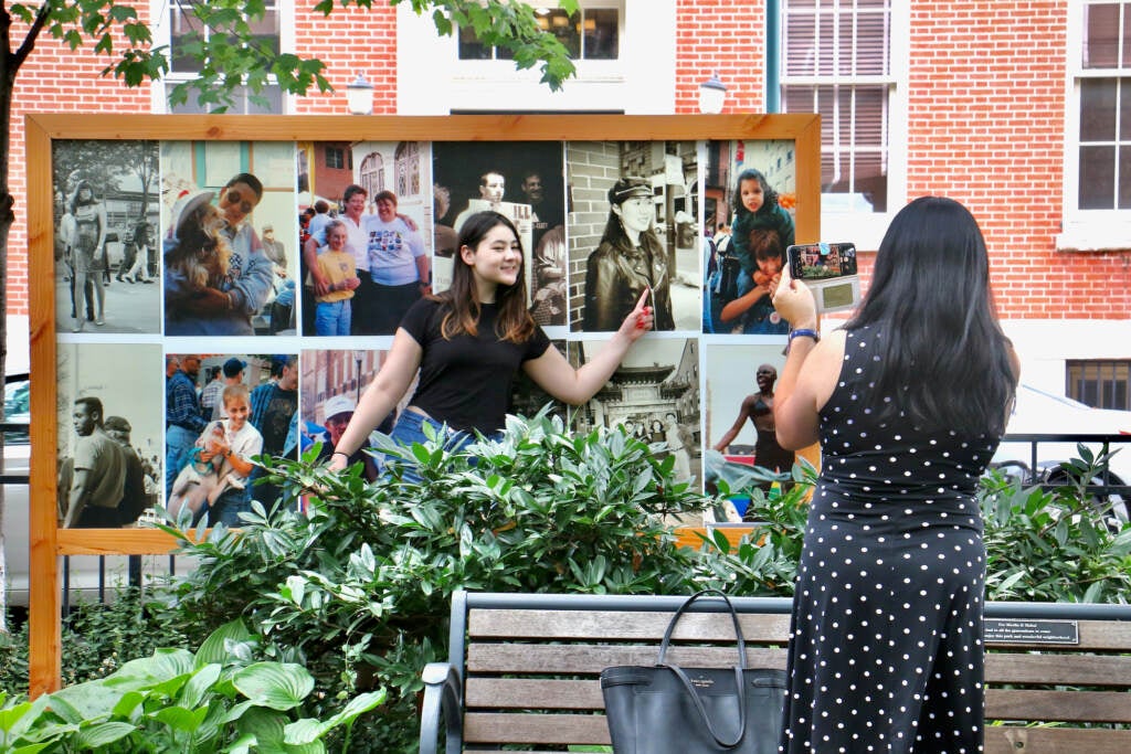 Lily Dominus, 15, points to a 1995 photograph of her mother, Lorrie Kim