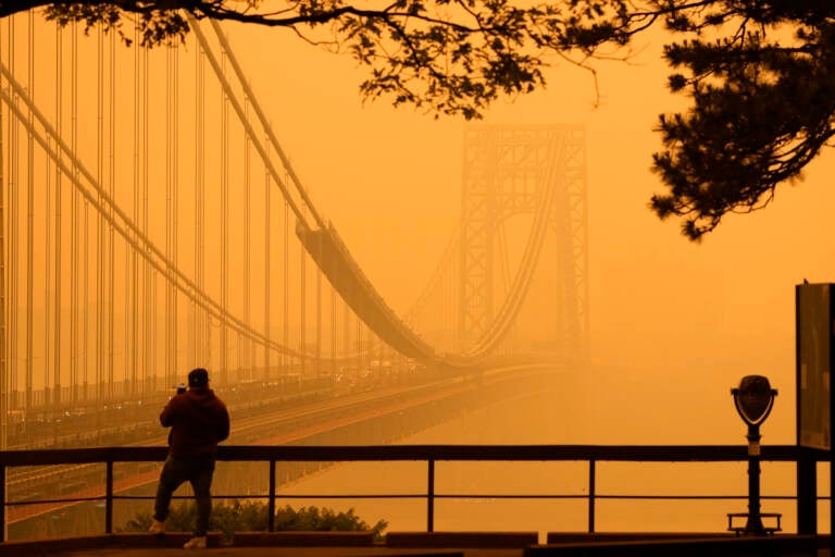 Patsy Crawford Kabar Canadian Wildfires Air Quality Alert   A Man Talks On His Phone Looking Through The Haze At The George Washington Bridge From Fort Lee NJ 768x512 