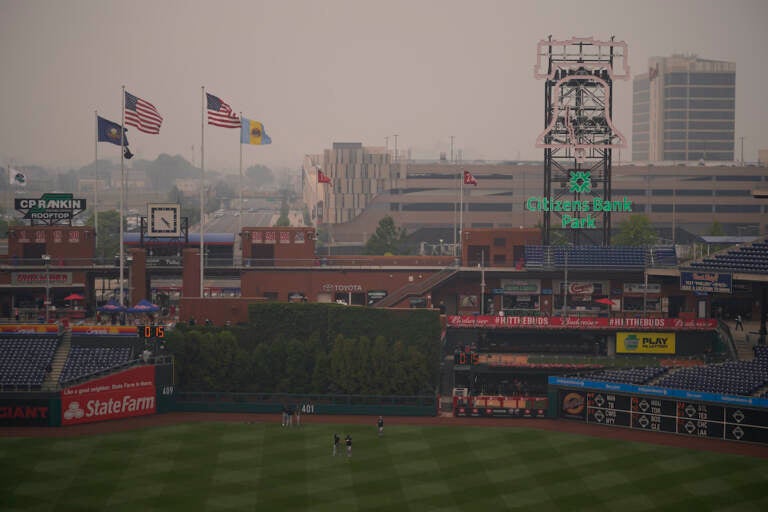 Detroit Tigers' players walk through the outfield at Citizens Bank Park after poor air quality postponed their baseball game against the Philadelphia Phillies, Wednesday, June 7, 2023, in Philadelphia