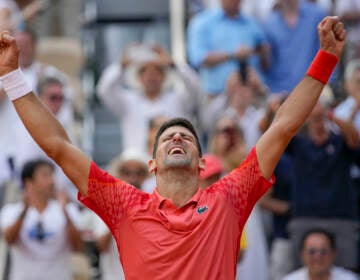 Serbia's Novak Djokovic celebrates winning the men's singles final match of the French Open tennis tournament against Norway's Casper Ruud in three sets, 7-6, (7-1), 6-3, 7-5, at the Roland Garros stadium in Paris, Sunday, June 11, 2023. Djokovic won his record 23rd Grand Slam singles title, breaking a tie with Rafael Nadal for the most by a man