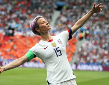 In this July 7, 2019 file photo, United States' Megan Rapinoe celebrates after scoring the opening goal from the penalty spot during the Women's World Cup final soccer match against The Netherlands at the Stade de Lyon in Decines, outside Lyon, France
