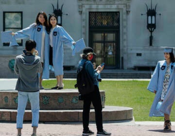 Columbia University class of 2020 graduates pose for photographs on Commencement Day on Wednesday, May 20, 2020, in New York.