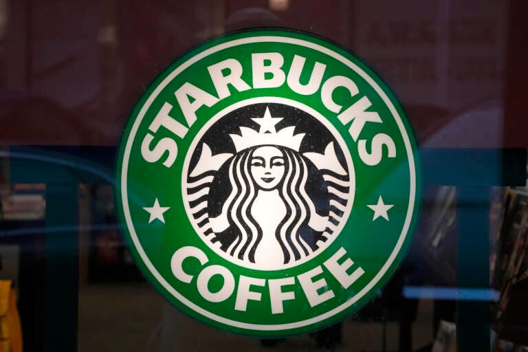 The Starbucks sign is displayed in the window of a Pittsburgh Starbucks, Jan. 30, 2023.