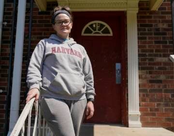 Samantha Richards stands outside of her apartment, Friday, June 9, 2023, in Bloomington, Ind. Richards has been on Medicaid her whole life and currently works two part-time jobs as a custodian