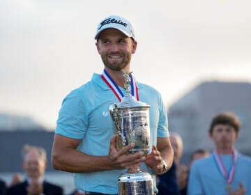 Wyndham Clark holds the holds the trophy after winning the U.S. Open golf tournament at Los Angeles Country Club on Sunday, June 18, 2023, in Los Angeles