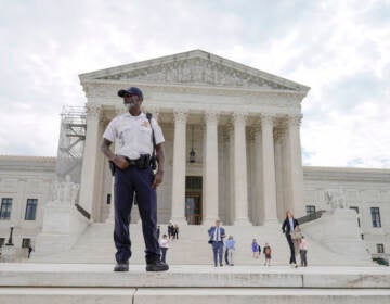A police officer stands outside of the U.S Supreme Court, Tuesday, June 27, 2023, in Washington. (AP Photo/Mariam Zuhaib)